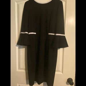Calvin Klein tea length dress with 3/4 sleeves. Size 12 in excellent condition.